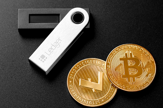 Hardware crypto wallet: the Ledger Nano S and some crypto coins.