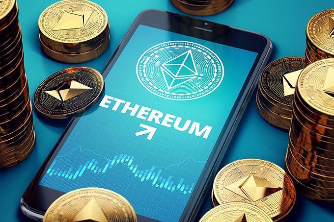 Best Ethereum wallet: a phone with Ether coins scattered around.