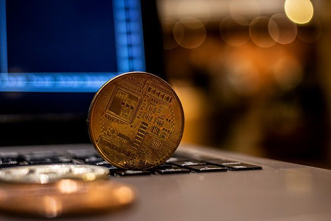 Follow coin: a cryptocurrency coin on a laptop.