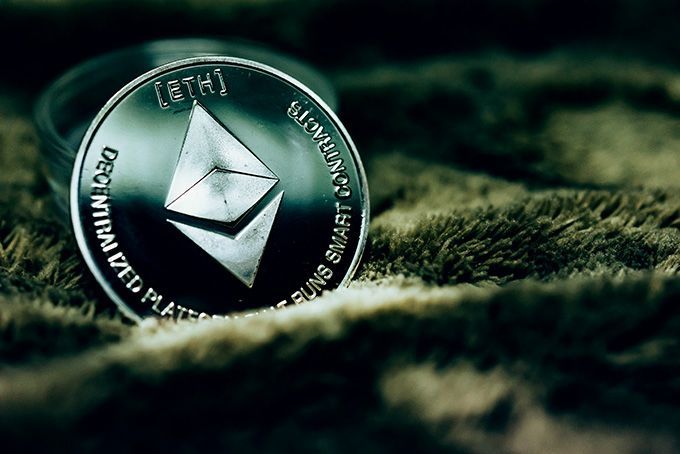 How to mine Ethereum on Windows: an Ether coin placed on a rug.