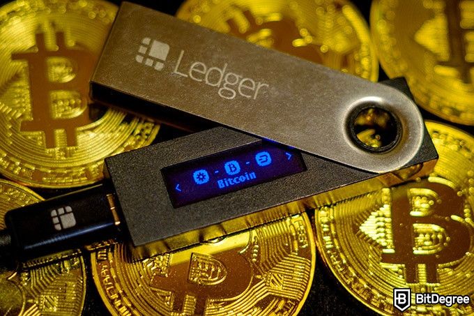 Tron wallet: the Ledger Nano S on a pile of Bitcoins.
