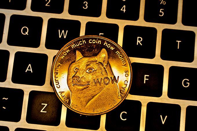 What is Dogecoin: a Dogecoin on a keyboard.