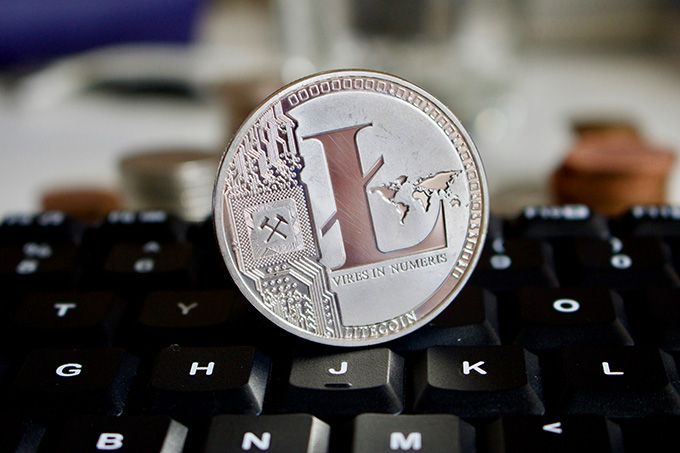 What is Litecoin: a Litecoin on a black keyboard.