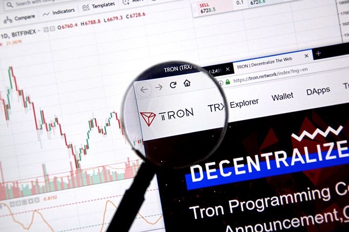 What is Tron Coin: the Tron website in front of a chart.