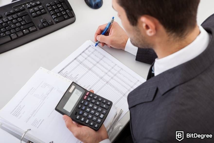 Best-paying jobs in finance: a man calculating taxes.