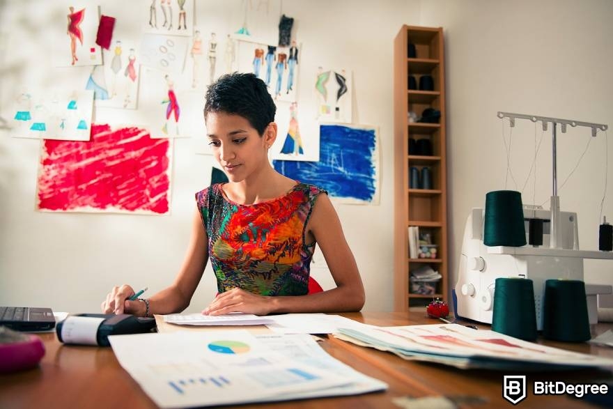 Best-paying jobs in finance: woman calculating finance-related details.