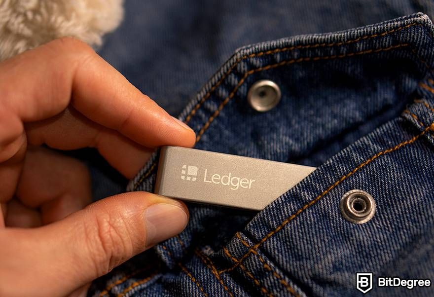 Buy gift cards with crypto: the Ledger cryptocurrency wallet in a jacket pocket.