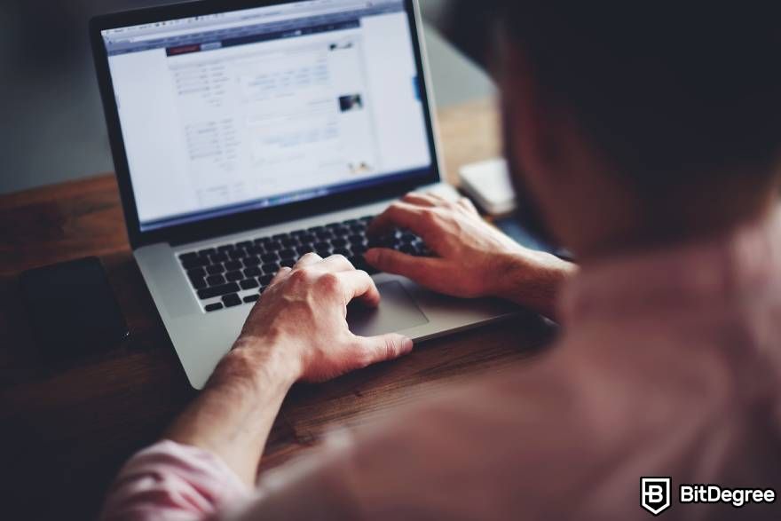 Buy Web3 domain: man working at a computer.