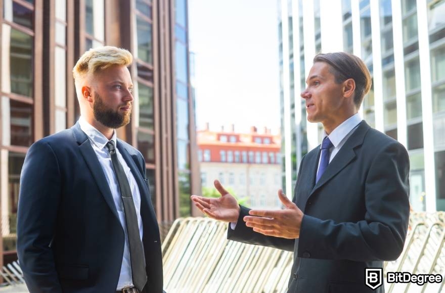 Crypto winter meaning: two investors talking.