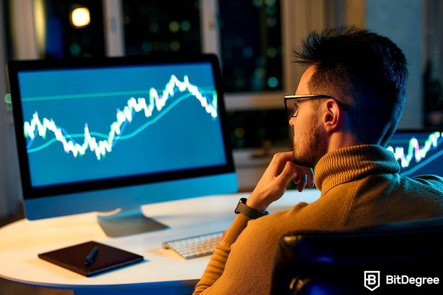 Cara trading crypto: Menganalisa grafik trading yang ada di laptop.