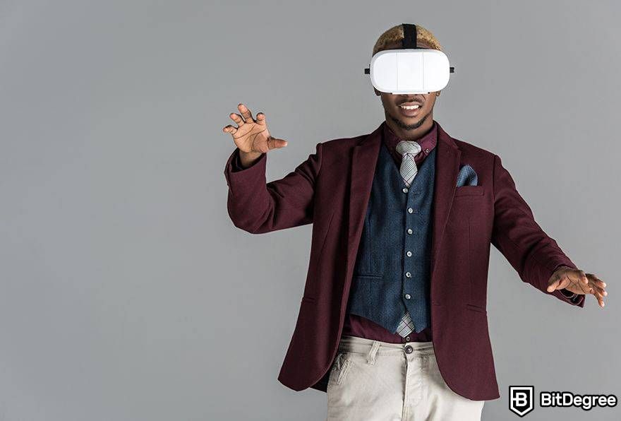 Interoperability in the metaverse: man in suit in VR making pose.