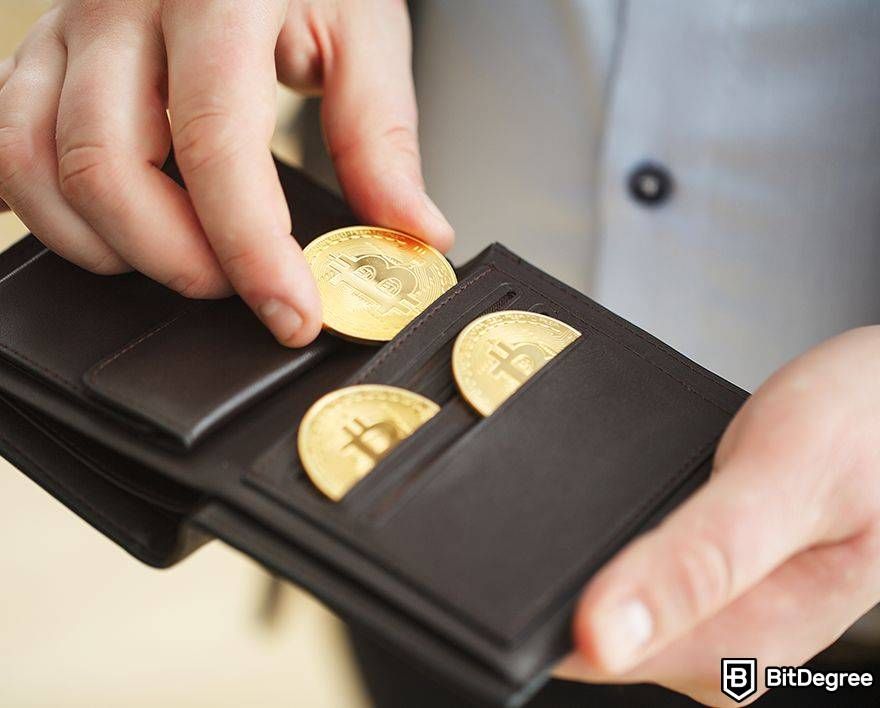 Largest lost Bitcoin wallet: Bitcoins being slotted into wallet.