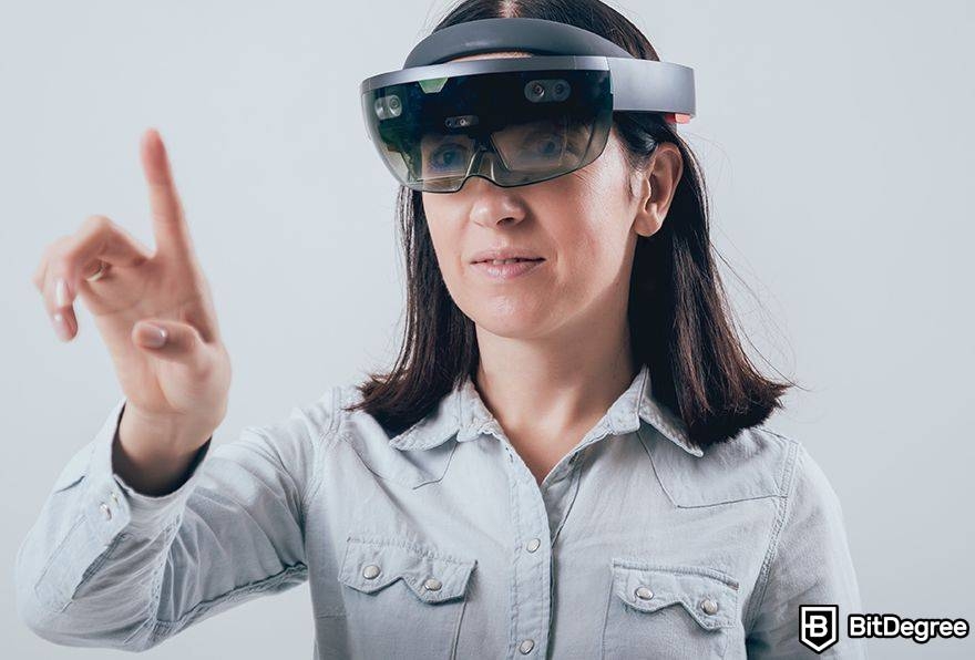 Metaverse augmented reality: woman in AR goggles pointing.