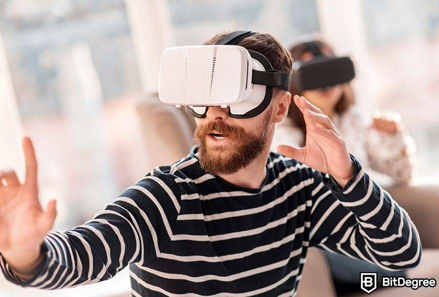 Metaverse laws: man poses with VR headset.