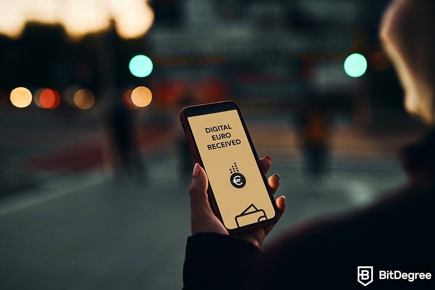 What is fiat in crypto: a person is holding a phone. The screen reads: digital euro received.