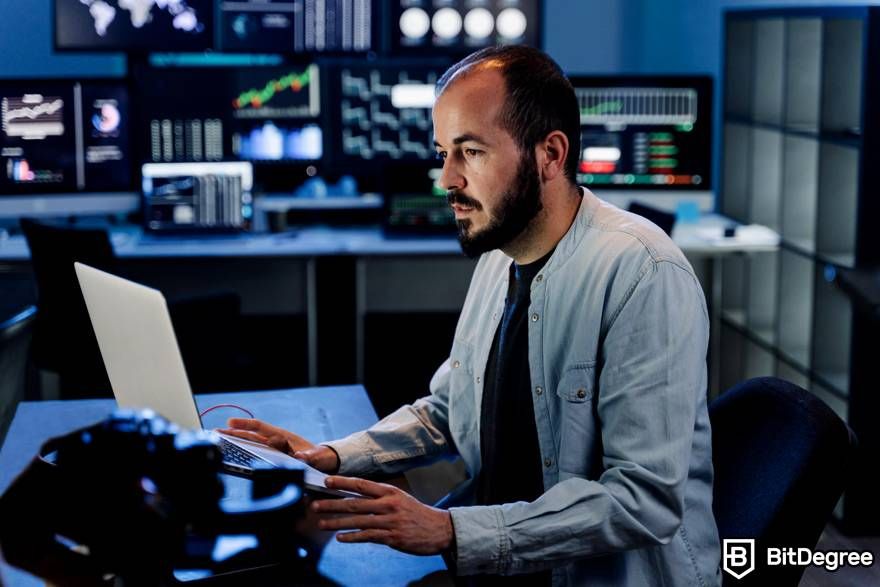 What is leverage trading crypto: a trader is working on his laptop.