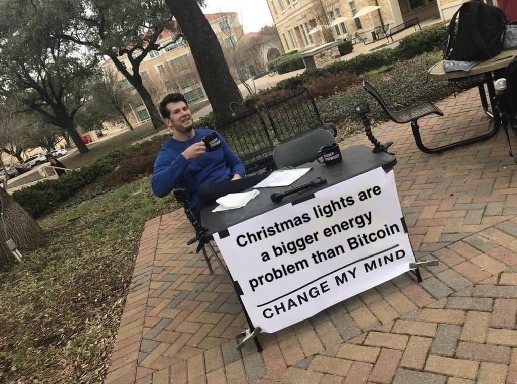 Meme about debating the energy consumption of Christmas lights versus Bitcoin.