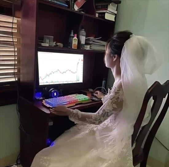 Image of a woman in a wedding dress looking at the charts
