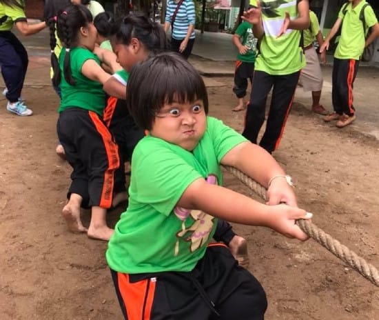 Picture of a kid in a tug-of-war Picture of a kid in a tug-of-war