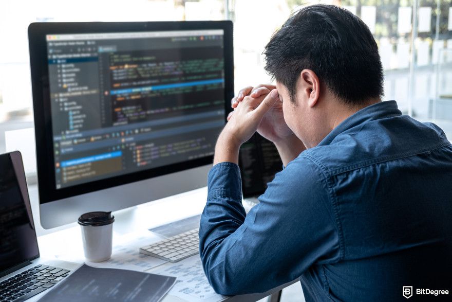 AI programming course: a stressed programmer.