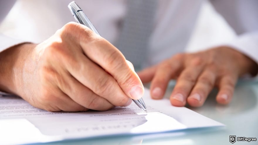 Anonymous casino: a person filling form with pen. Anonymous casino: a person filling form with pen.