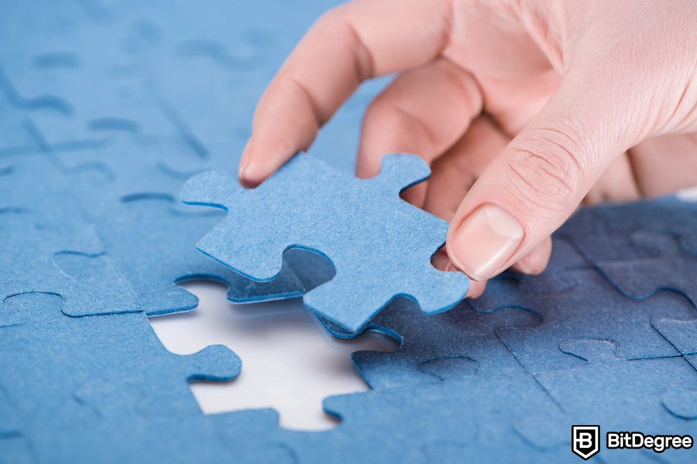 Application of blockchain: a person inserting the last missing puzzle.