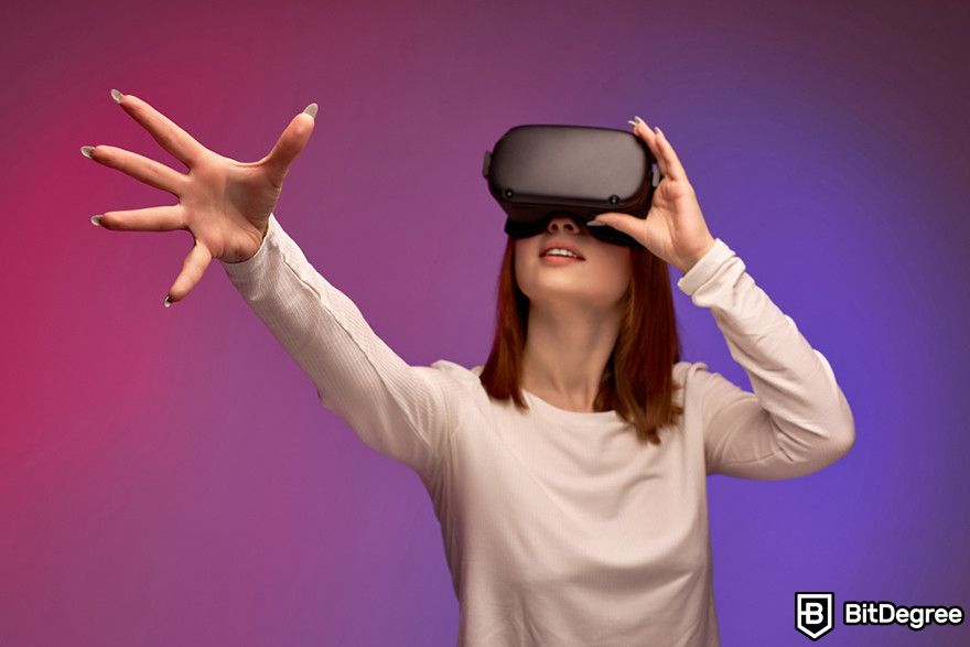 Are NFTs dead: a person wearing a VR headset with their hand reaching out.