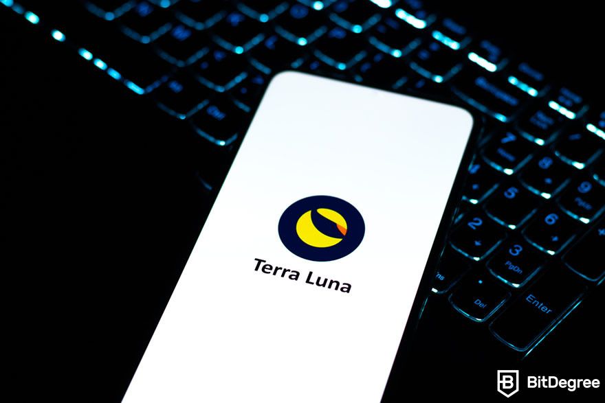 Are NFTs dead: a mobile phone on a laptop keyboard displaying the Terra Luna logo.