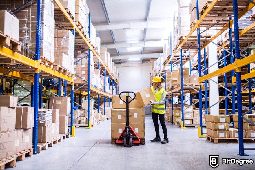 Benefits of cryptocurrency: A warehouse worker loading boxes.