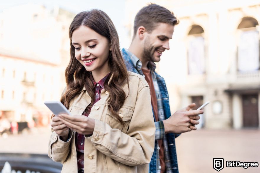 Best AI companion: two people chatting on their phones.