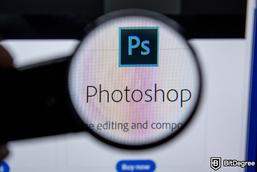 Best AI photo enhancer: Photoshop logo displayed on a screen.