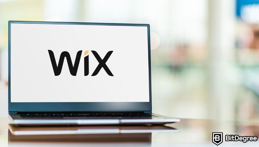 Best AI website builder: Wix logo displayed on a laptop.