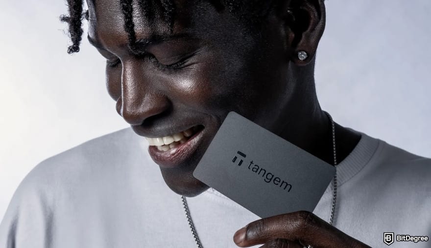 Best Cardano wallet: a person holding a Tangem wallet. Best Cardano wallet: a person holding a Tangem wallet.