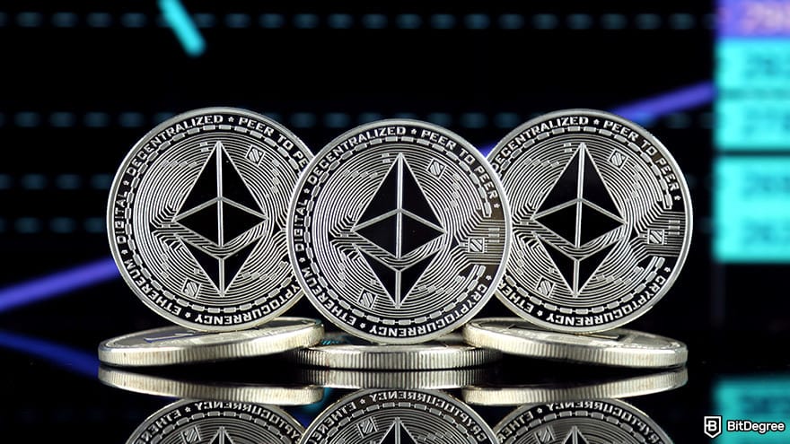 Best crypto airdrops: three physical ETH coins stacked on a table, representing the Ethereum ICO.