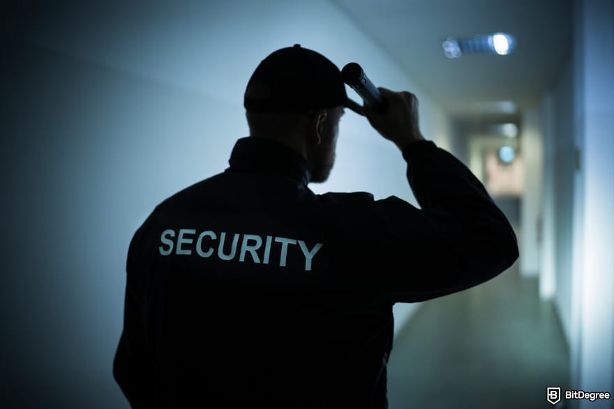 Best crypto bridges: a person with a jacket that has security written on it.