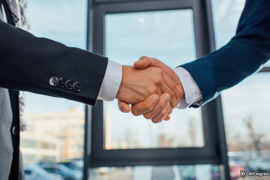 Best crypto exchange South Africa: two men shaking hands.