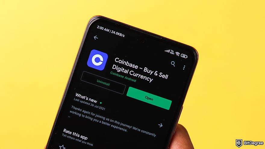 Best crypto exchange for day trading: a phone showing the Coinbase App page on Google Play.