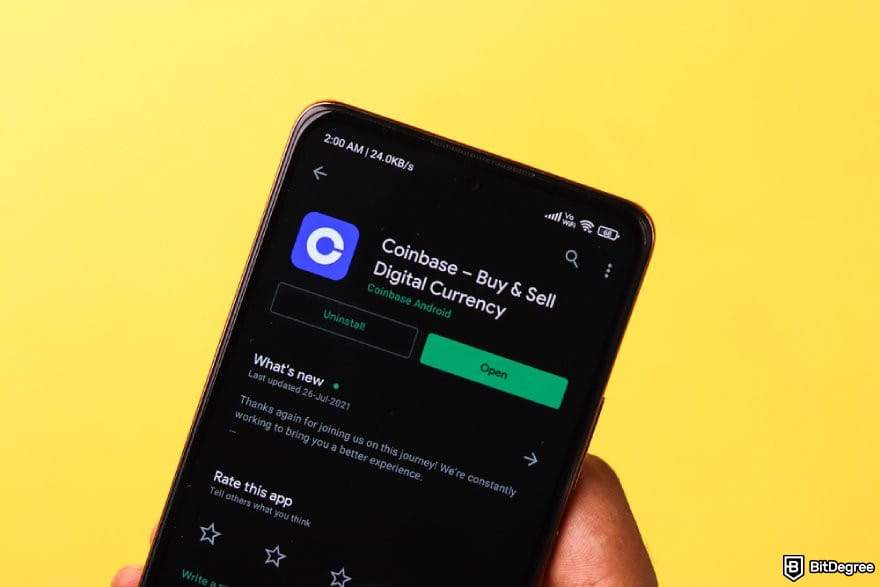 Best crypto exchange for day trading: a phone showing the Coinbase App page on Google Play.