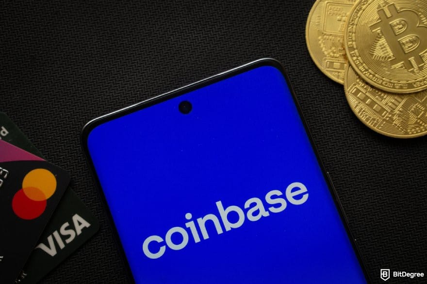 Best crypto exchange for day trading: a phone displaying the Coinbase app logo next to a stack of BTC coins.