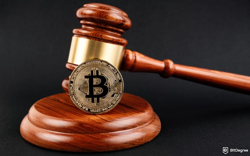 Best crypto exchanges in Europe: a judge's hammer with a Bitcoin next to it.