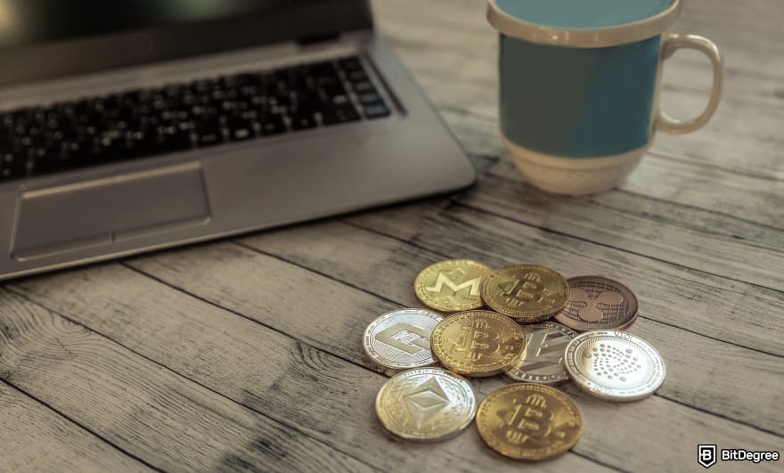 Best crypto exchanges in Europe: a laptop with a few crypto coins next to it.