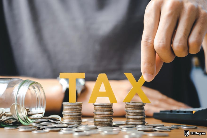 Best crypto exchanges in Mexico: word tax and stacked coins put on desks.