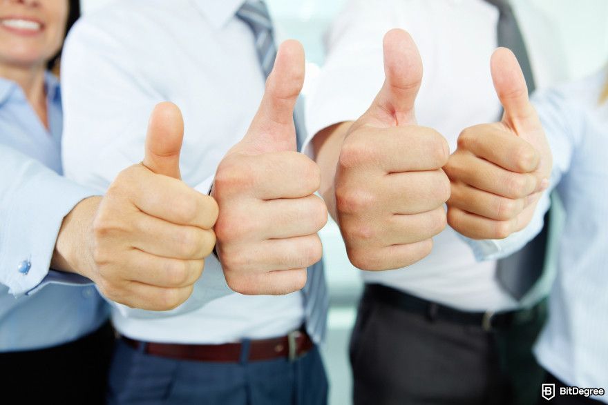 Best crypto options trading platform: A group of people giving thumbs up.