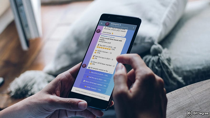 Best crypto Telegram groups: person scrolling thru BitDegree Telegram channel.