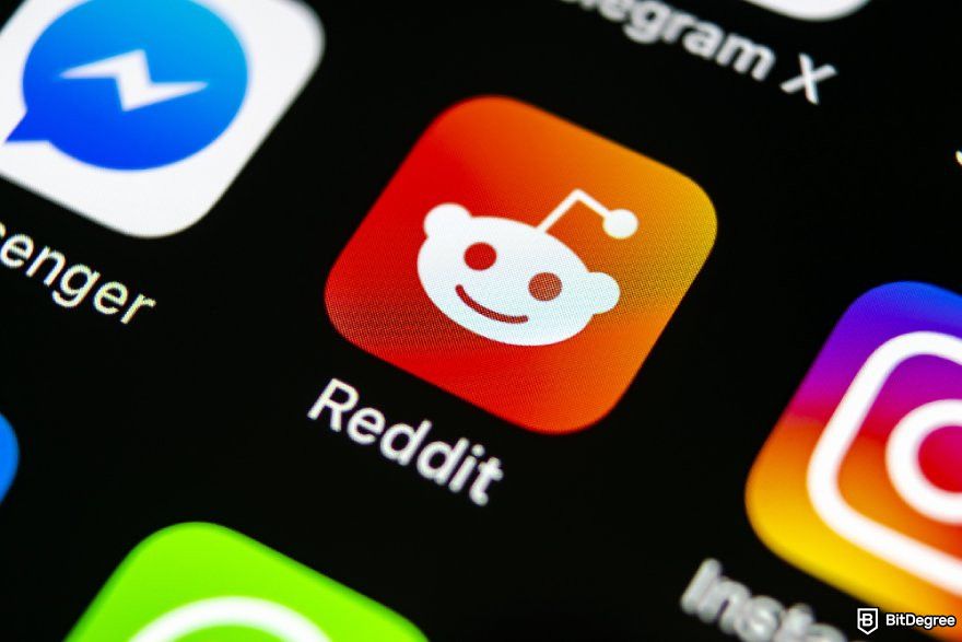 Best crypto under a penny: a close-up of the Reddit app along with other social apps displayed on a screen.