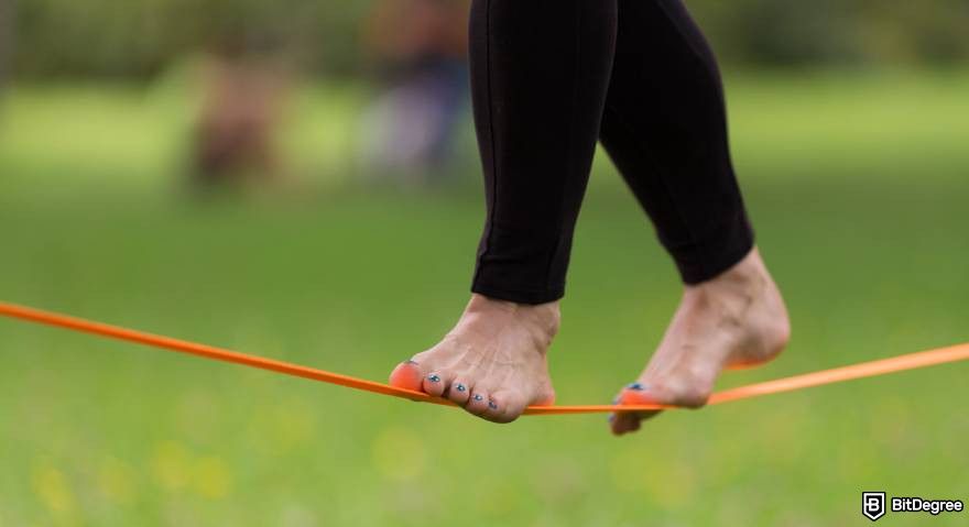 Best crypto under a penny: feet balancing on a slackline.