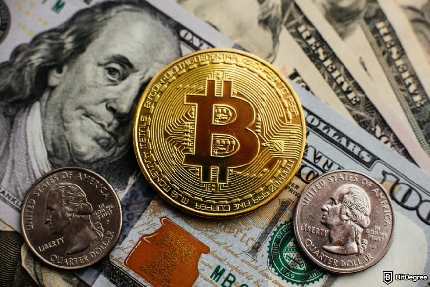 Best cryptocurrency to invest today for short term: a BTC coin placed on USD bills and quarters.