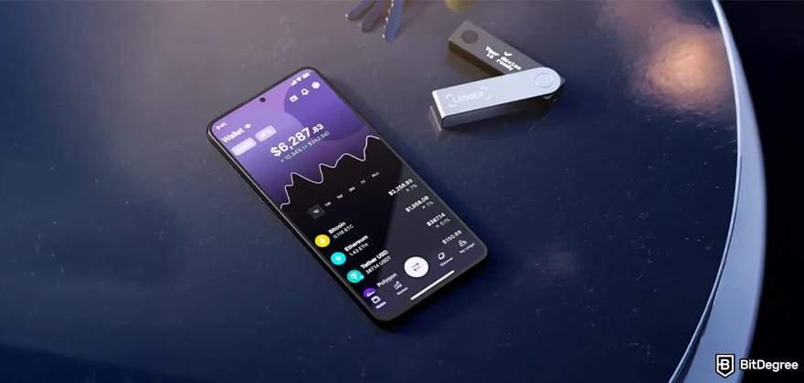 Best Ethereum wallet: Ledger wallet and a phone on a table.