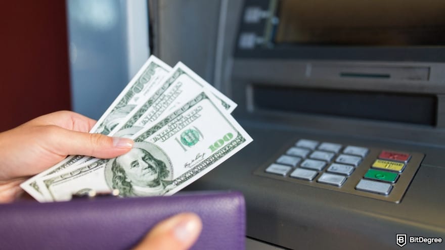 Best fast withdrawal casino: close up of hand withdrawing money at ATM. Best fast withdrawal casino: close up of hand withdrawing money at ATM.