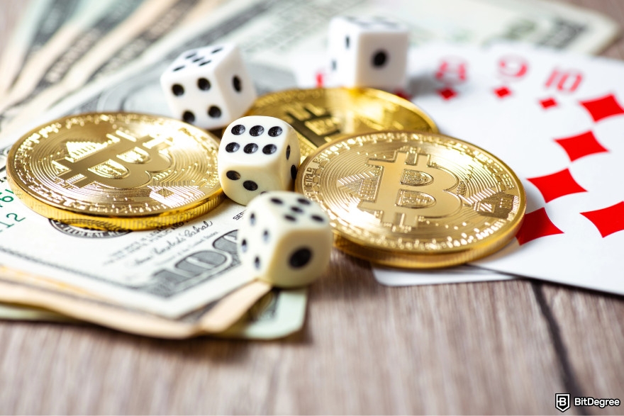 Best free crypto airdrops: a few Bitcoins lying next to cards and dice.